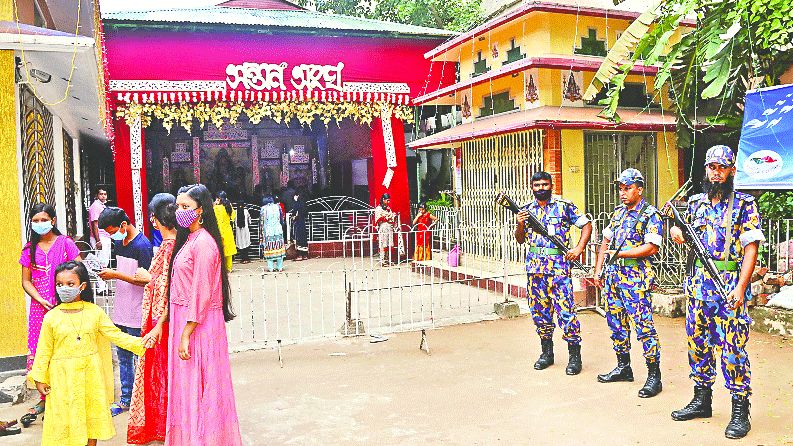 Law enforcement at a puja mandap in Cumilla after incidents of violence took place