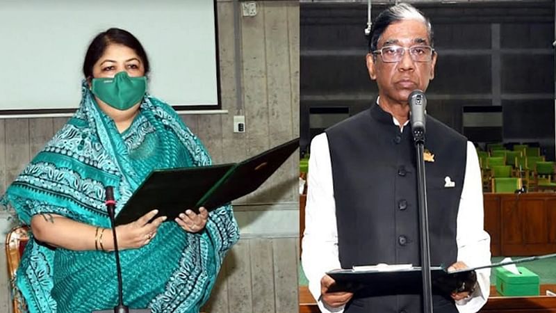 Jatiya Sangsad Speaker Shirin Sharmin Chaudhury (L) administers the oath to Pran Gopal Dutta as an MP at Jatiya Sangsad Bhaban on 30 September 2021