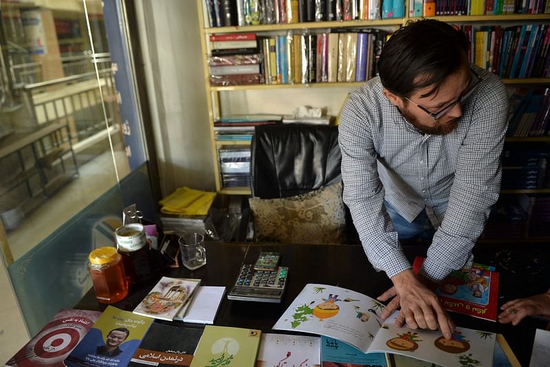 This picture taken on 23 October, 2021 shows Abdul Amin Hossaini, a middle-aged bookseller, talking during an interview with AFP in Kabul