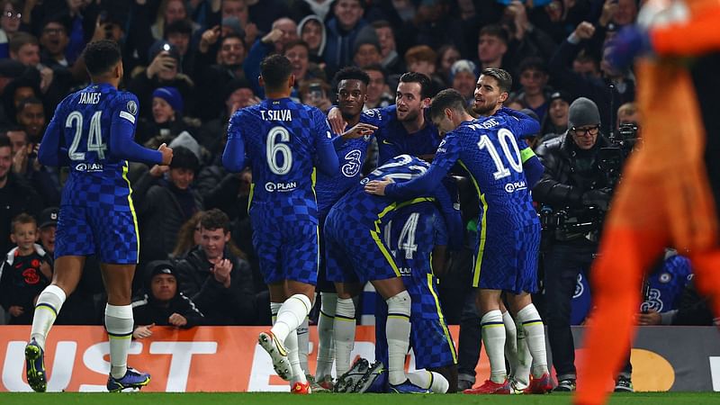 Chelsea's English defender Trevoh Chalobah celebrates with teammates after scoring the opening goal of the UEFA Champions League Group H football match between Chelsea and Juventus at Stamford Bridge in London on 23 November, 2021.