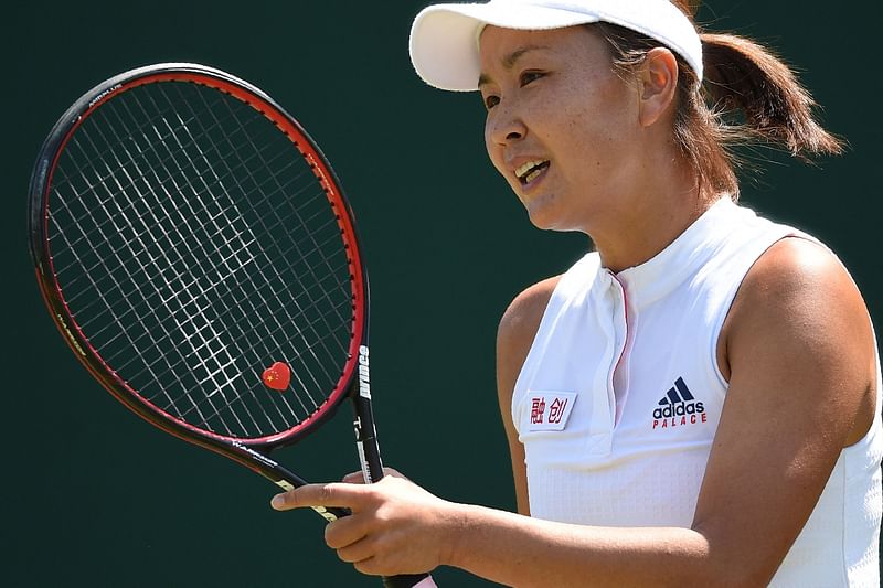 In this file photo taken on 3 July, 2018, China's Peng Shuai reacts against Australia's Samantha Stosur during their women's singles first round match on the second day of the 2018 Wimbledon