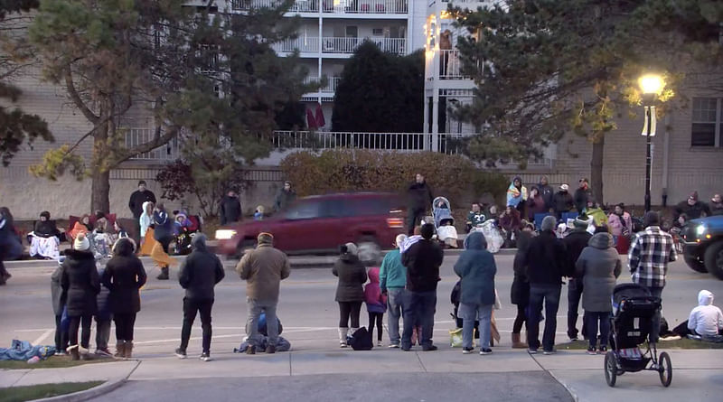 This video screen shot taken from the Facebook live streaming of the City of Waukesha, shows a red SUV speeding through the holiday parade crowd in Waukesha, Wisconsin, 21 November, 2021.