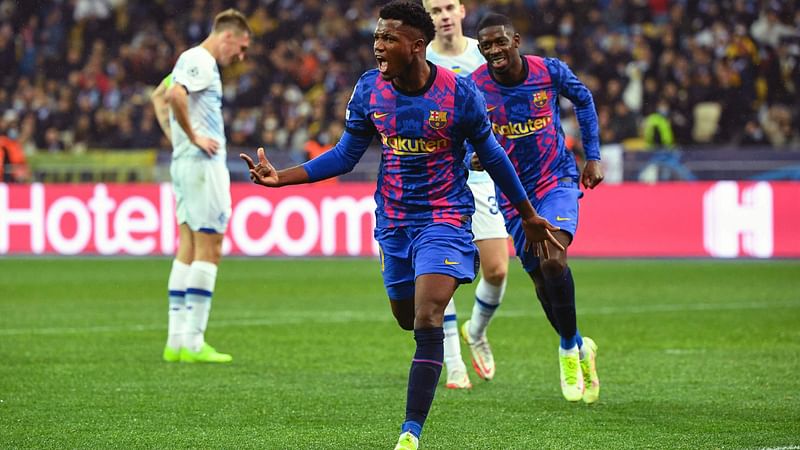 Barcelona's Spanish forward Ansu Fati celebrates after scoring the opening goal during the UEFA Champions League football match between Dynamo Kiev and Barcelona at the Olympic Stadium in Kiev on 2 November, 2021