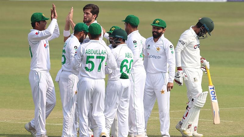 Pakistan team celebrate the wicket of Saif Hasan in the first session of first Test at Zahur Ahmed Chowdhury Stadium on 26 November 2021