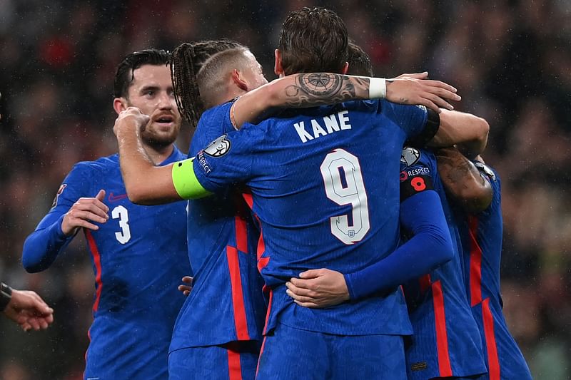 England's midfielder Jordan Henderson celebrates with teammates after scoring their third goal during the FIFA World Cup 2022 Group I qualifier football match between England and Albania at Wembley Stadium in London on 12 November, 2021