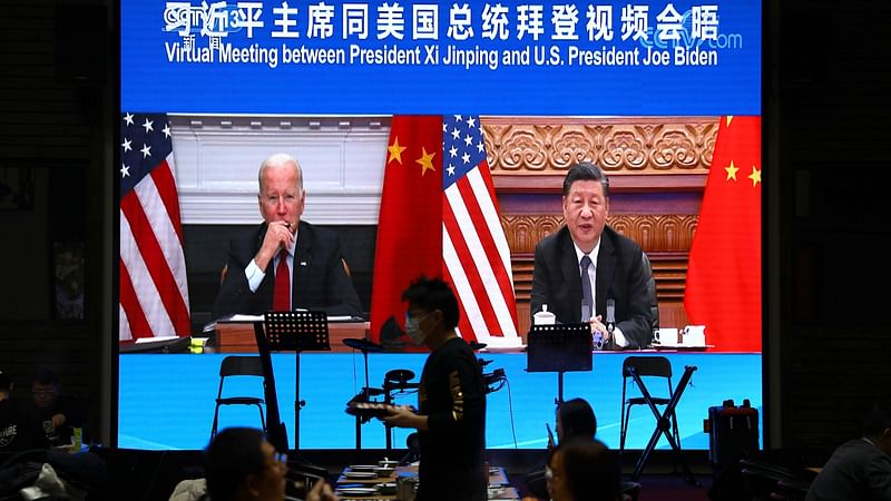 A screen shows Chinese President Xi Jinping attending a virtual meeting with U.S. President Joe Biden via video link, at a restaurant in Beijing, China on 16 November 2021