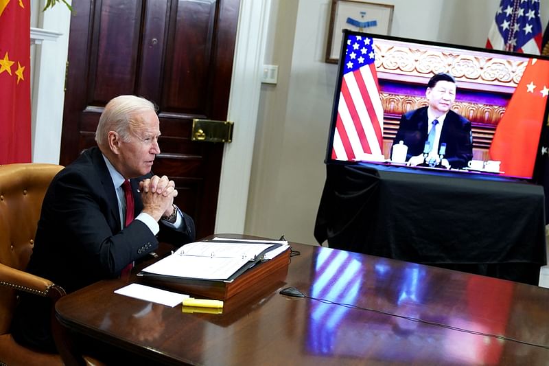 In this file photo taken on 15 November, 2021, US president Joe Biden meets with China's President Xi Jinping during a virtual summit from the Roosevelt Room of the White House in Washington, DC