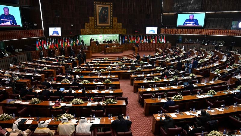 Pakistan's Foreign Minister Shah Mahmood Qureshi addresses the opening of a special meeting of the 57-member Organisation of Islamic Cooperation (OIC) in Islamabad on 19 December, 2021