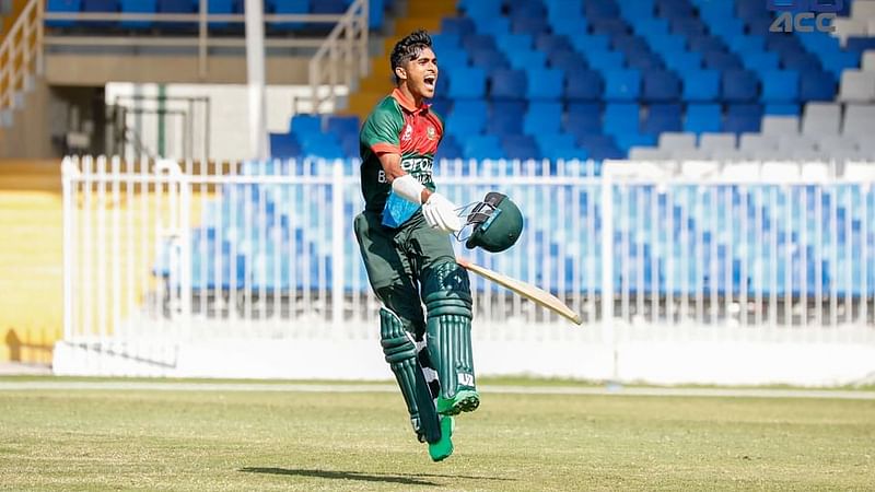 Prantik Nawrose Nabil celebrates after completing his century at Sharjah Cricket Stadium in Sharjah, UAE on 24 December, 2021