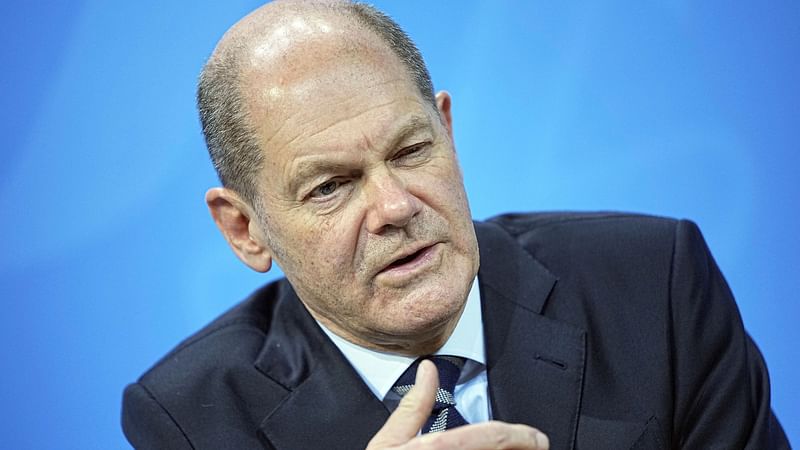 German Chancellor Olaf Scholz attends a news conference in the Federal Chancellery following the video conference with the country's 16 state leaders on the surge in the coronavirus disease (COVID-19) cases, in Berlin, Germany, on 9 December 2021