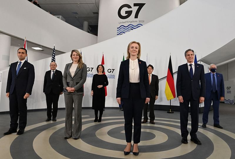 (L-R) G7 foreign ministers, Italy's Foreign Minister Luigi Di Maio, France's Minister for Europe and Foreign Affairs Jean-Yves Le Drian, Canada's Minister of Foreign Affairs Melanie Joly, Germany's Foreign Minister Annalena Baerbock, Britain's Foreign Secretary Liz Truss, Japan's Foreign Minister Yoshimasa Hayashi, US Secretary of State Antony Blinken and European High Representative of the Union for Foreign Affairs Josep Borrell pose in a socially distanced manner for a group photograph ahead of bilateral talks at the G7 Foreign and Development Ministers meeting in Liverpool, northwest England on 11 December 2021