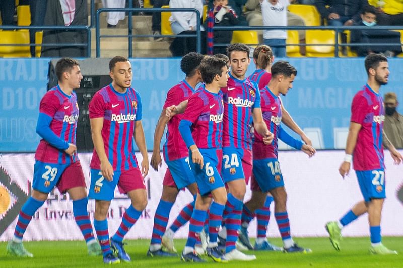 Barcelona's players celebrate a goal during a friendly football match between Spain's Barcelona and Argentina's Boca Juniors part of the Maradona Cup at the Mrsool Park Stadium in the Saudi capital Riyadh on 14 December, 2021