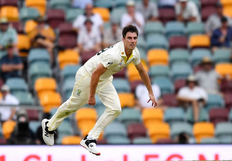 Australia's Captain Pat Cummins bowls during day one of the first Ashes cricket Test match between England and Australia at the Gabba in Brisbane on 8 December, 2021