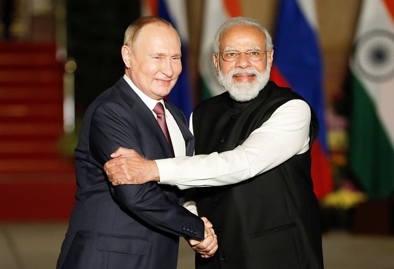 Russia's President Vladimir Putin shakes hands with India's Prime Minister Narendra Modi ahead of their meeting at Hyderabad House in New Delhi, India, 6 December, 2021