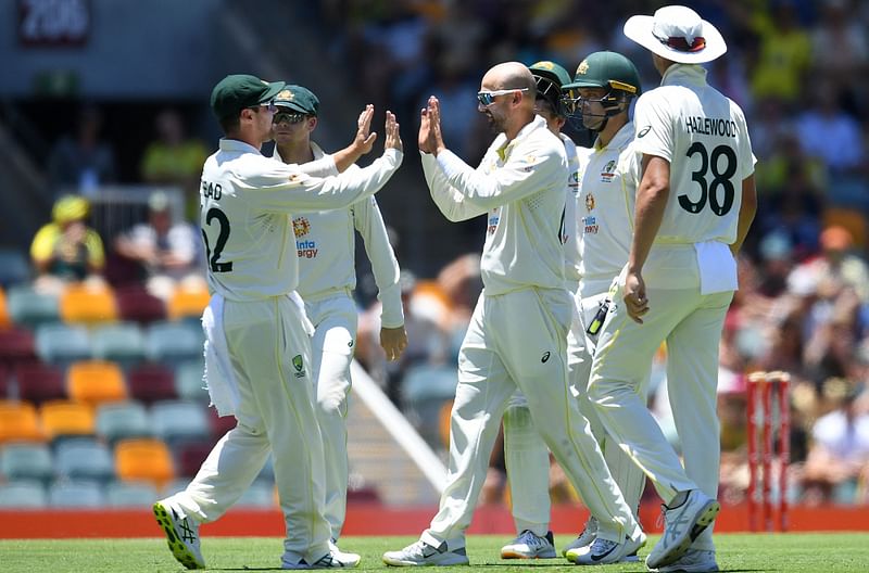 f England with teammate Travis Head (L) during day four of the first Ashes cricket Test match between England and Australia at the Gabba in Brisbane on 11 December, 2021