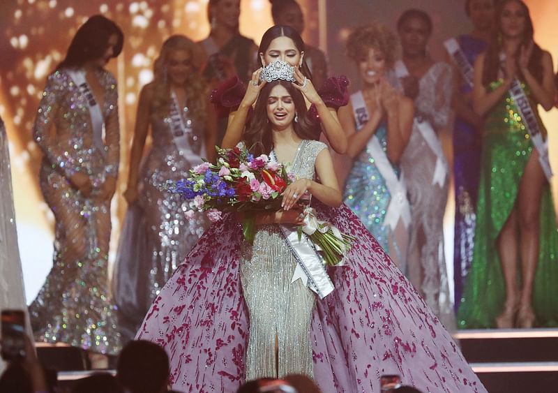 Miss Universe winner Miss India Harnaaz Sandhu reacts as the Miss Universe crown is placed on her head by Outgoing Miss Universe Andrea Meza of Mexico, at the Red Sea resort of Eilat, Israel 13 December, 2021