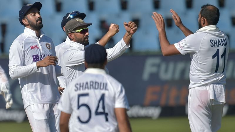 India's Mohammed Shami (R) celebrates with teammates after the dismissal of South Africa's Wiaan Mulder (not seen) during the third day of the first Test cricket match between South Africa and India at SuperSport Park in Centurion on 28 December, 2021