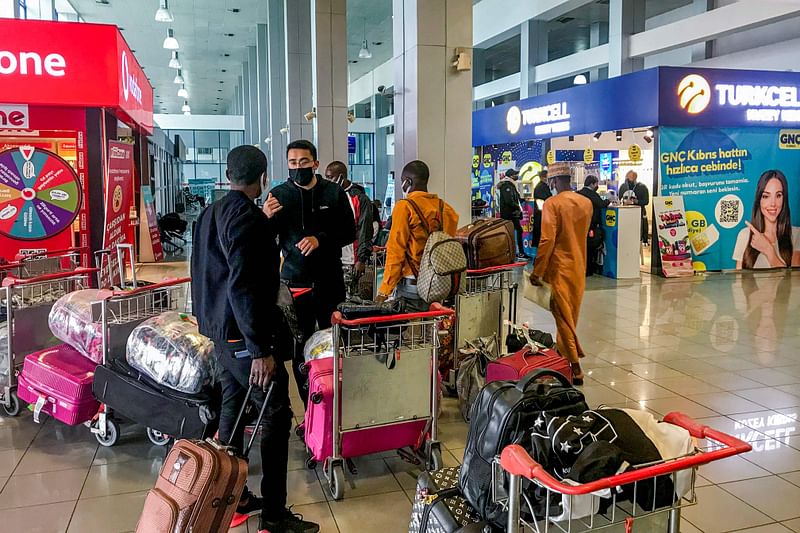 Travellers' luggage trolleys are seen at the terminal at Ercan airport, which serves the self-proclaimed Turkish Republic of Northern Cyprus (TRNC), lying east of the capital Nicosia in the Turkish-controlled northern part of the divided Mediterranean island on 25 November, 2021