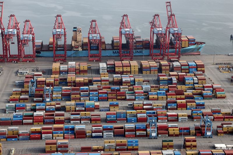 Shipping containers are unloaded from a ship at a container terminal at the Port of Long Beach-Port of Los Angeles complex, in Los Angeles, California, US, 7 April, 2021