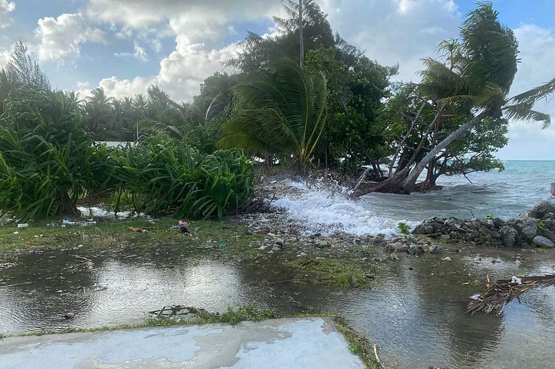 A photo taken on 6 December 2021 shows high-tide flooding in the Marshall Islands capital Majuro