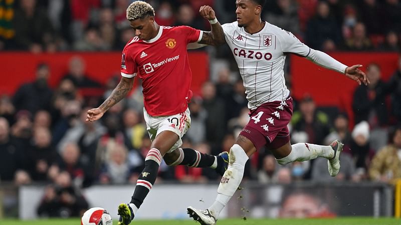 Manchester United's English striker Marcus Rashford (L) vies with Aston Villa's English defender Ezri Konsa (R) during the English FA Cup third round football match between Manchester United and Aston Villa at Old Trafford in Manchester, north-west England, on 10 January, 2022