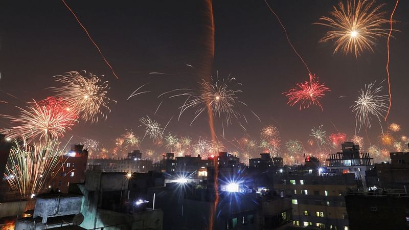 New Year firecrackers light the night sky in Old Dhaka