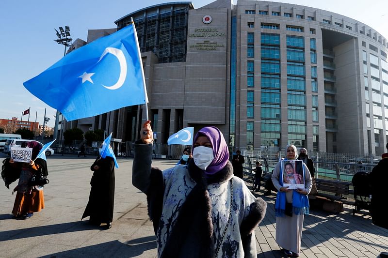 Ethnic Uyghur women take part in a protest against China, in front of the Caglayan Courthouse, in Istanbul, Turkey, 4 January, 2022