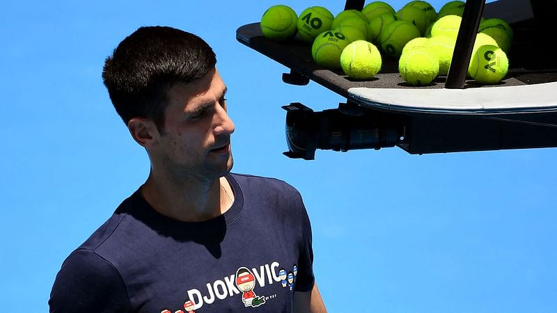 Novak Djokovic of Serbia takes a break during a practice session ahead of the Australian Open at the Melbourne Park tennis centre in Melbourne on 12 January, 2022