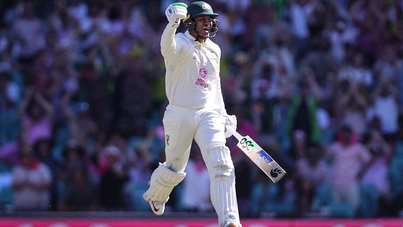 Australia's Usman Khawaja celebrates reaching his century (100 runs) on day four of the fourth Ashes cricket test between Australia and England at the Sydney Cricket Ground (SCG) on 8 January, 2022