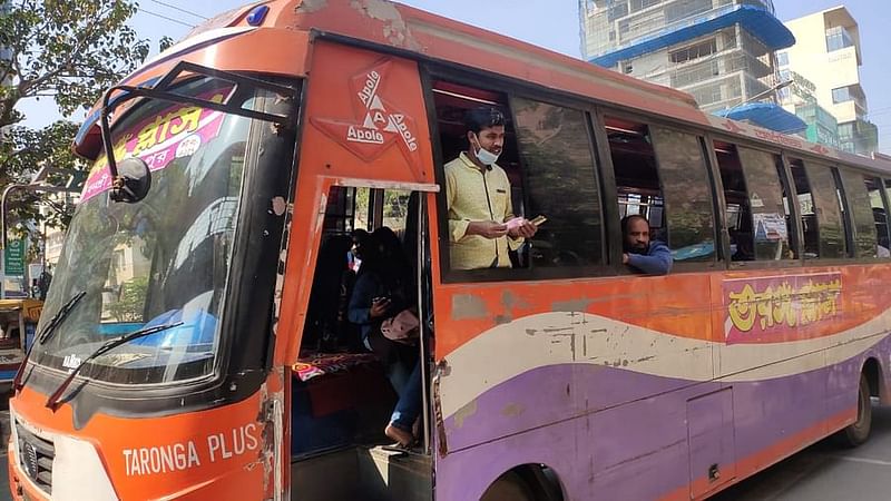 He's wearing a mask, but on his chin. A common scene in the capital city's public transport