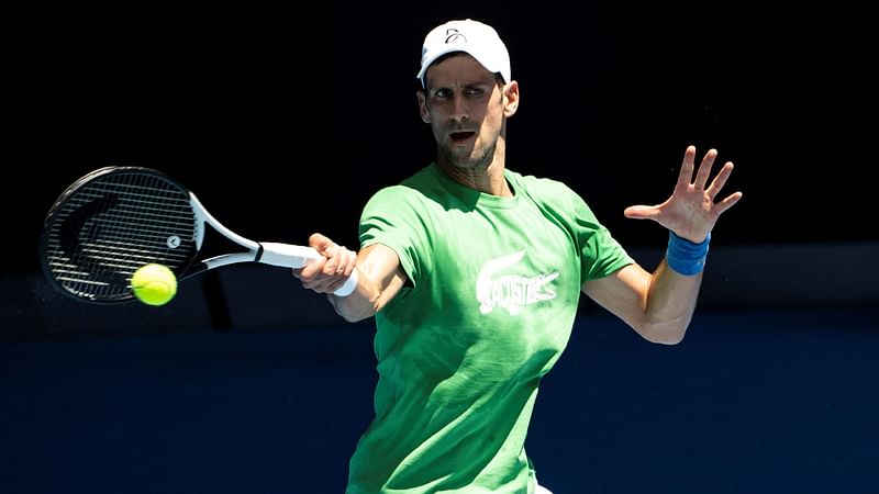 Novak Djokovic of Serbia takes part in a practice session ahead of the Australian Open tennis tournament in Melbourne on 13 January, 2022