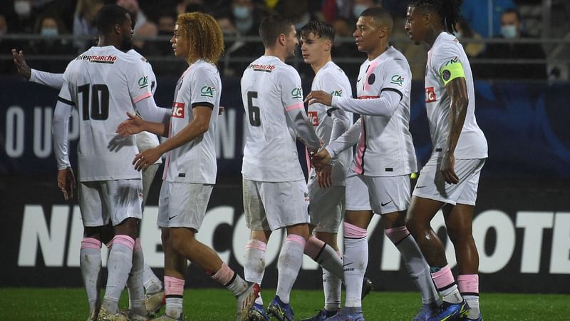 Paris Saint-Germain's French forward Kylian Mbappe (2nd R) celebrates with teammates after he scored his team's second goal during the French Cup round of 16 football match against Vannes OC at La Rabine Stadium in Vannes, western France, on 3 January, 2022