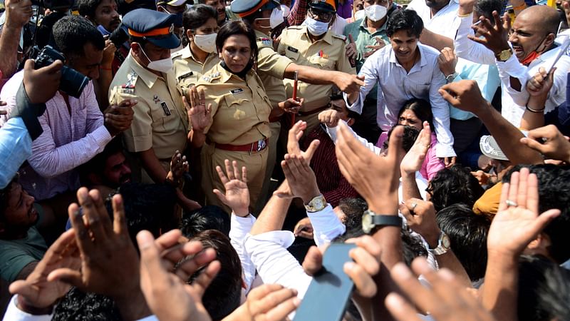 Activists and supporters of Mumbai Pradesh Youth Congress party scuffle with the Police and shout slogans during a protest against alleged surveillance operation using the Israeli-built Pegasus spyware, in Mumbai on 2 February 2022.