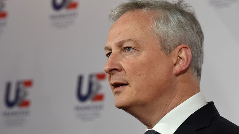 French Economy and Finance Minister Bruno Le Maire speaks to the press with German Finance Minister (unseen) about Russia's invasion of Ukraine at the Economy Ministry in Paris on 25 February 2022, prior to the start of an informal Ecofin and Eurogroup meeting.