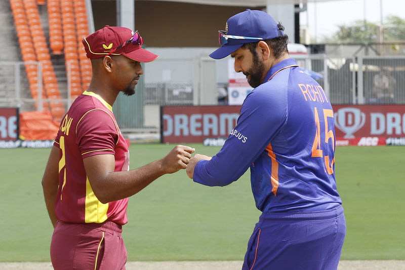 West Indies skipper Nicholas Pooran greets Indian skipper Rohit Sharma after the toss at the Narendra Modi Stadium in Ahmedabad on 9 February, 2022