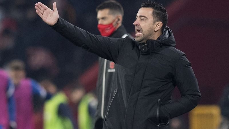 Barcelona's Spanish coach Xavi Hernandez reacts during the Spanish league football match between Granada FC and FC Barcelona at Nuevo Los Carmenes stadium in Granada on 8 January, 2022.