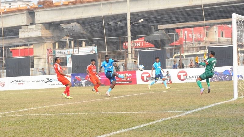 Chittagong Abahani's Nigerian forward Ebimobowei shoots to score during a BPL match against Sheikh Russel KC at the Shaheed Ahsan Ullah Master Stadium in Tongi, Gazipur on 9 February, 2022