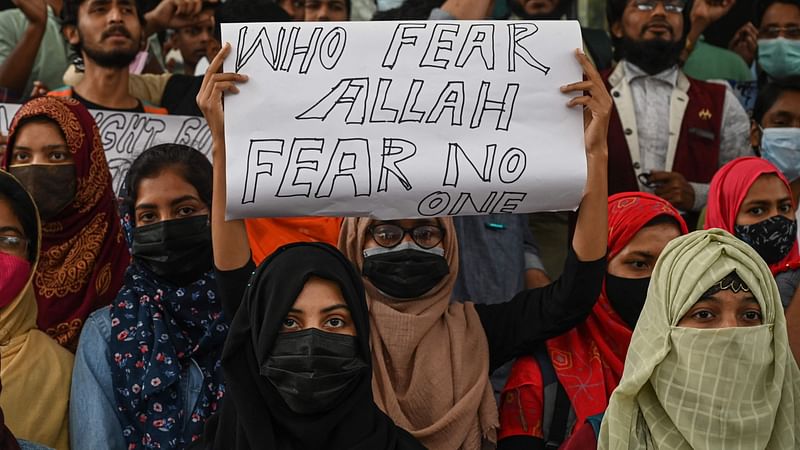 Students carrying placards take part in a demonstration in Kolkata on 9 February 2022, to protest after students at government-run high schools in India's Karnataka state were told not to wear hijabs in the premises of the institute.