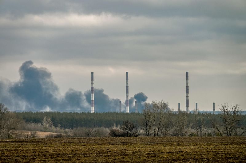 Smoke rises from a power plant after shelling outside the town of Schastia, near the eastern Ukraine city of Lugansk, on 22 February 2022, a day after Russia recognised east Ukraine's separatist republics and ordered the Russian army to send troops there as "peacekeepers."