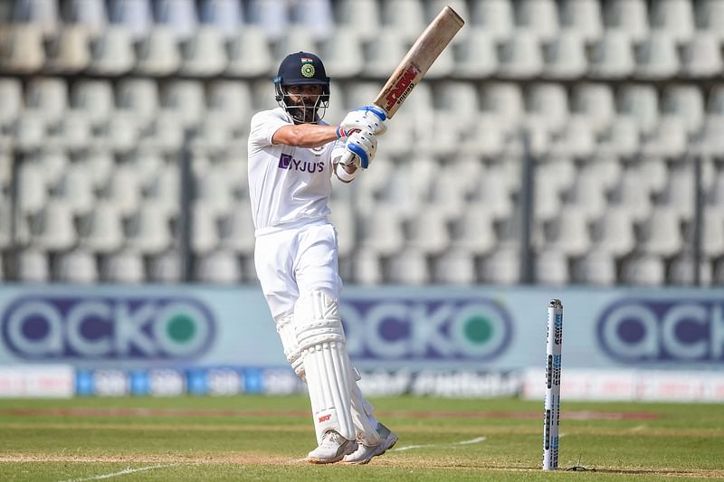 n this file photo taken on 5 December 2021 India's captain Virat Kohli plays a shot during the third day of the second Test cricket match between India and New Zealand at the Wankhede Stadium in Mumbai