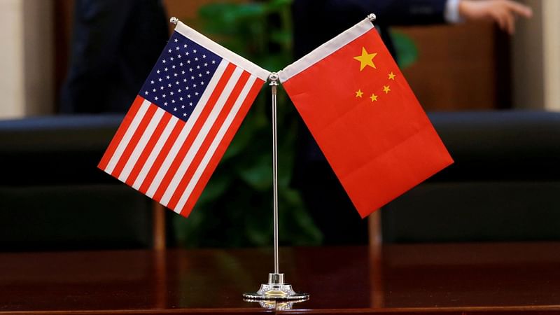 Chinese and US flags are set up for a signing ceremony at China`s Ministry of Transport in Beijing, China on 27 April 2018.