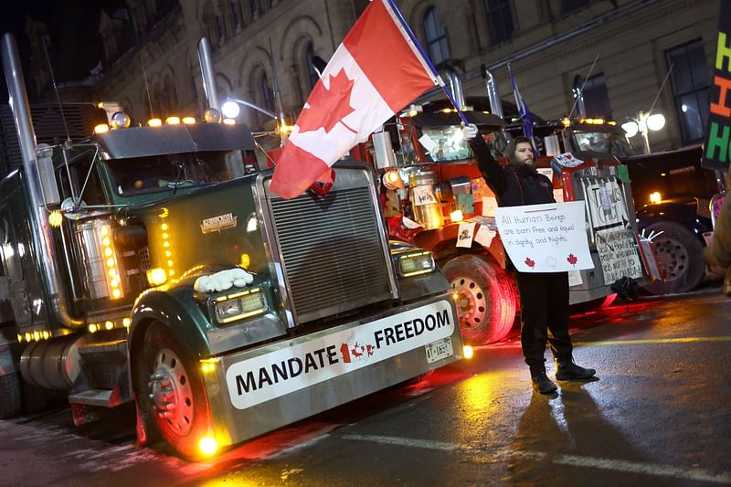 Trucks block downtown streets near the Parliament Buildings as a demonstration led by truck drivers protesting vaccine mandates continues on 15 February, 2022 in Ottawa, Ontario, Canada.