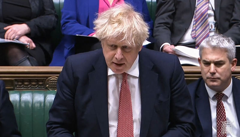 A video grab from footage broadcast by the UK Parliament's Parliamentary Recording Unit (PRU) shows Britain's Prime Minister Boris Johnson reacting as he updates MPs on the Covid-19 situation in the country, in the House of Commons, in London, on 21 February