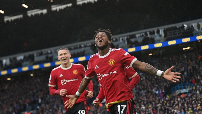 Manchester United's Brazilian midfielder Fred (C) celebrates after scoring his team third goal during the English Premier League football match between Leeds United and Manchester United at Elland Road in Leeds, northern England on 20 February, 2022