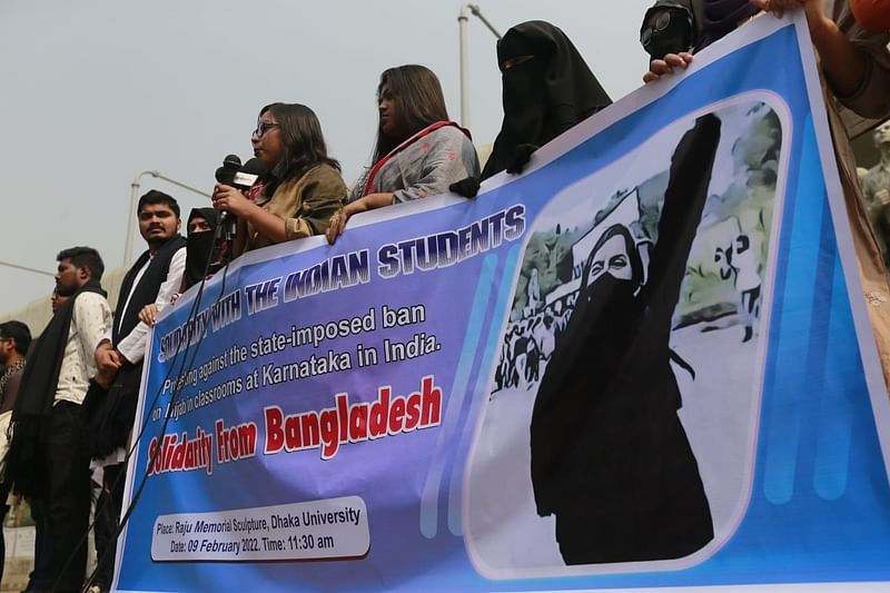 A section of students of Dhaka University (DU) forms a human chain at Raju Sculpture on DU campus protesting the ban on wearing hijab at an educational institution in Karnataka of India. The picture was taken on 9 February.