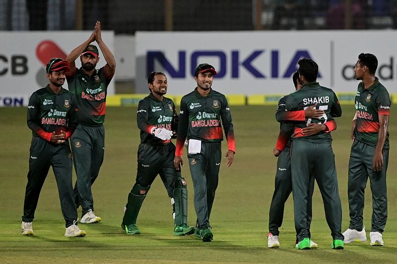 Bangladesh's players celebrates after the dismissal of Afghanistan's Mohammad Nabi (not pictured) during the second one-day international (ODI) cricket match between Afghanistan and Bangladesh at the Zahur Ahmed Chowdhury Stadium in Chittagong on 25 February, 2022