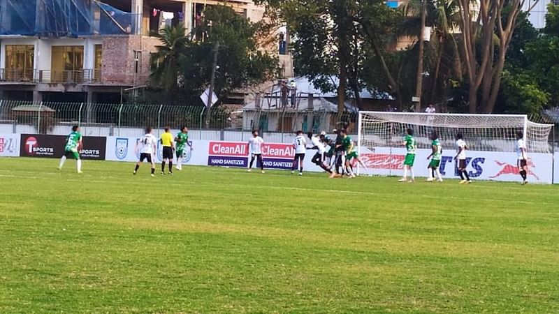 Players of Sheikh Jamal Dhanmondi Club and Mohammedan Sporting Club Limited vie for ball during a BPL Football match on 28 February, 2022