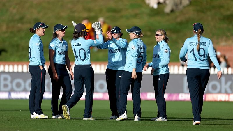 England's players celebrate a wicket during the Women's Cricket World Cup match against Bangladesh at the Basin Reserve in Wellington on 27 March 2022.