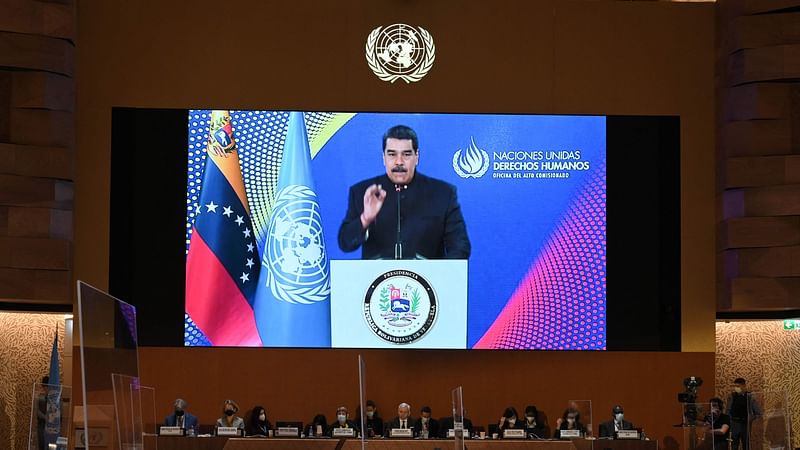 Venezuelan President Nicolas Maduro appears on a screen as he gives a remote speech at the opening of a session of the UN Human Rights Council on 28 February, 2022 in Geneva