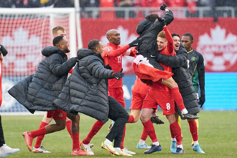 The Canadian mens soccer team celebrate after defeating Jamaica 4-0 in their World Cup Qualifying match at BMO Field in Toronto, Ontario, Canada 27 March, 2022. Canada qualified for the World Cup for the first time in 36 years on Sunday with an emphatic 4-0 victory over Jamaica in Toronto